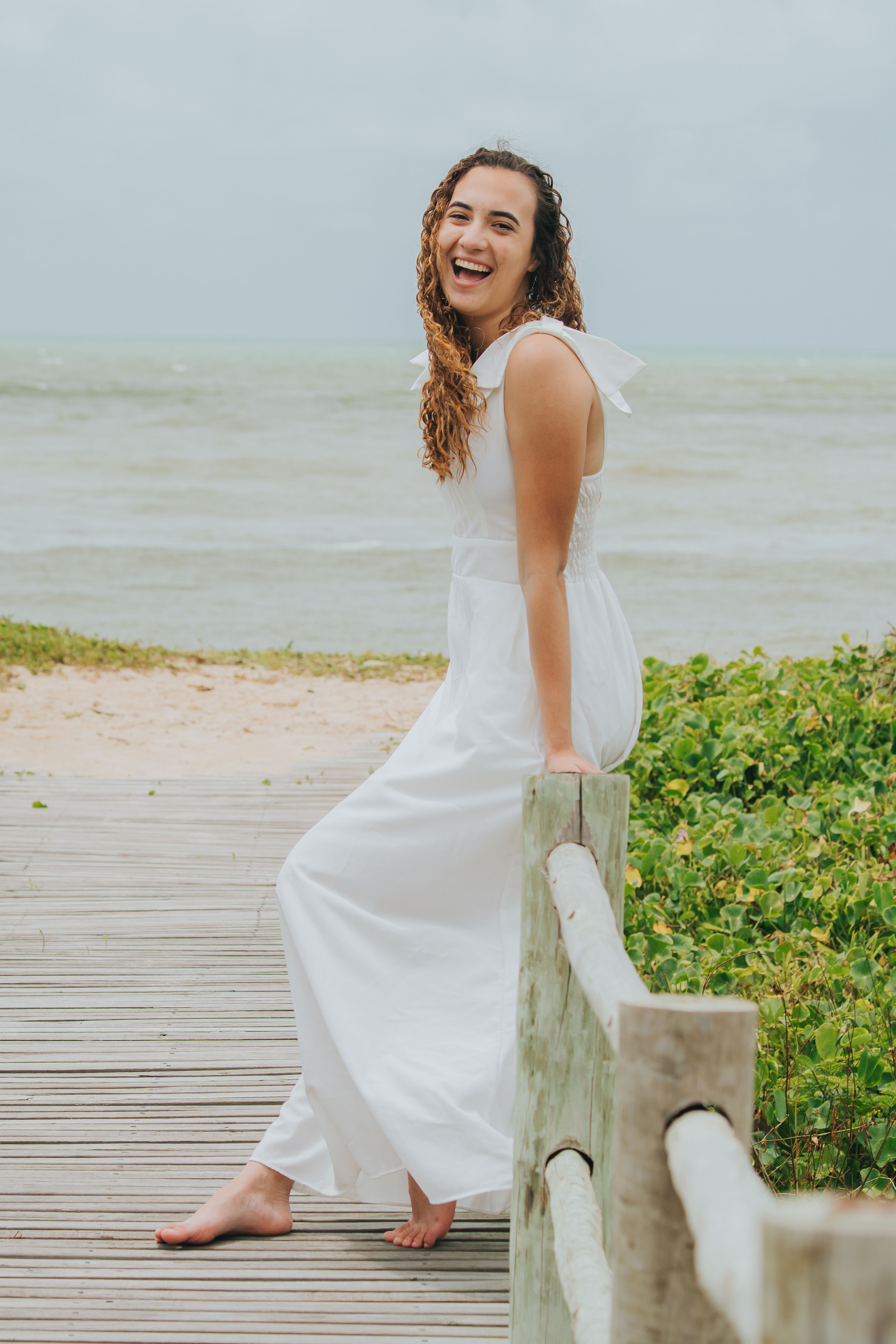 Smiling Woman in White Dress by the Beach · Free Stock Photo