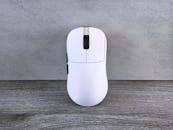 White Wireless Computer Mouse on Wooden Table