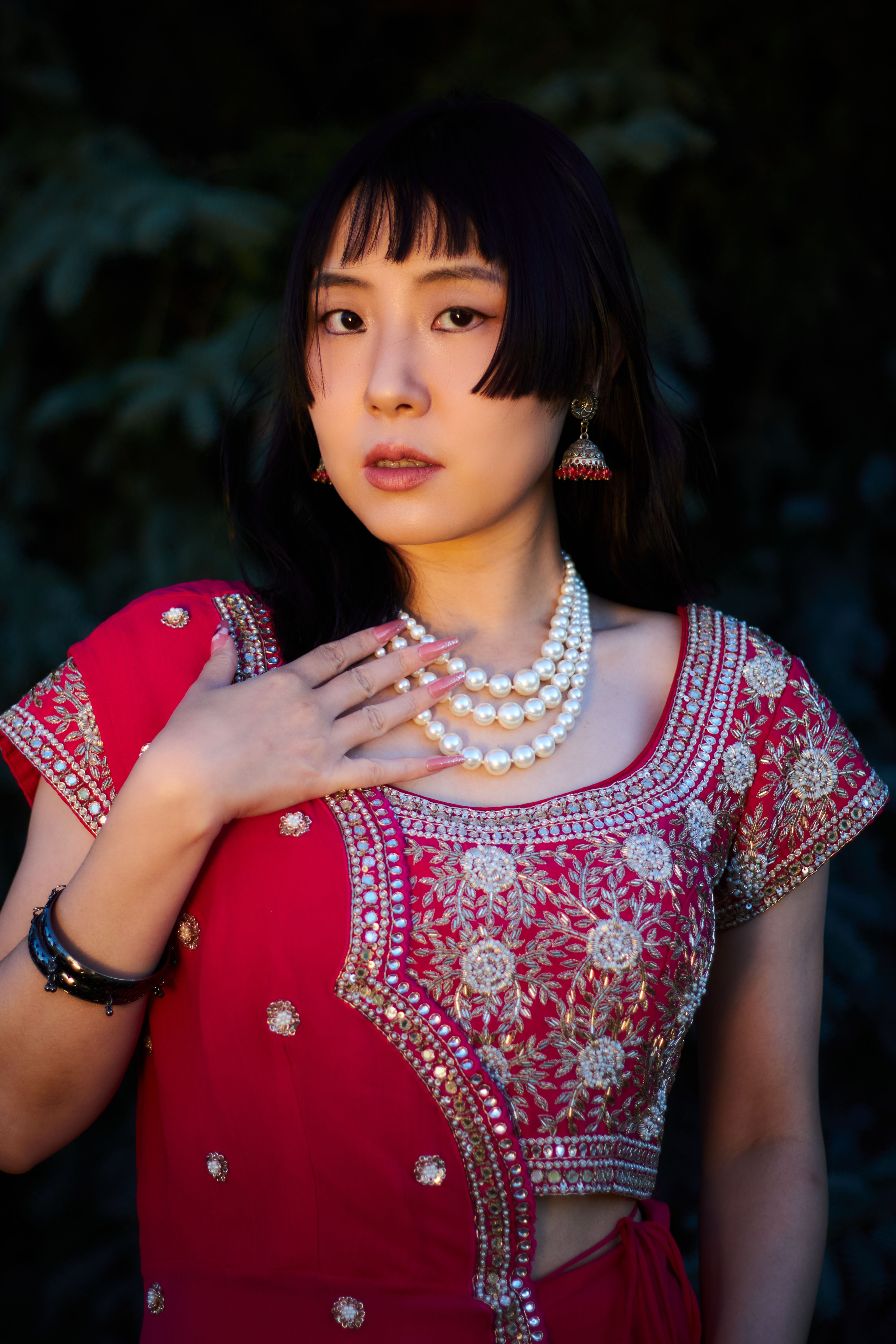 Elegant Woman in Traditional Pink Indian Attire Outdoors · Free Stock Photo