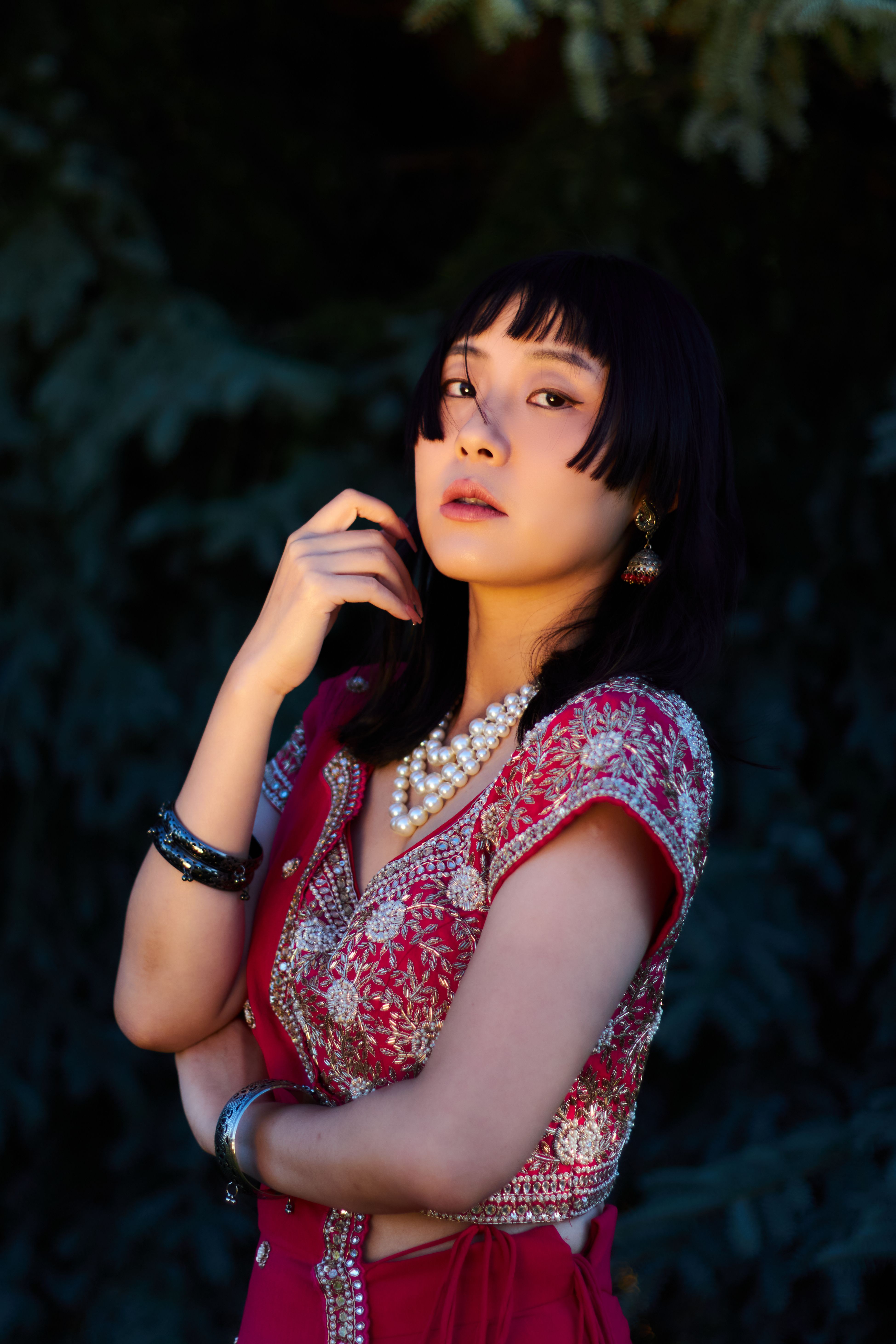 Elegant Portrait of Woman in Traditional Red Attire · Free Stock Photo