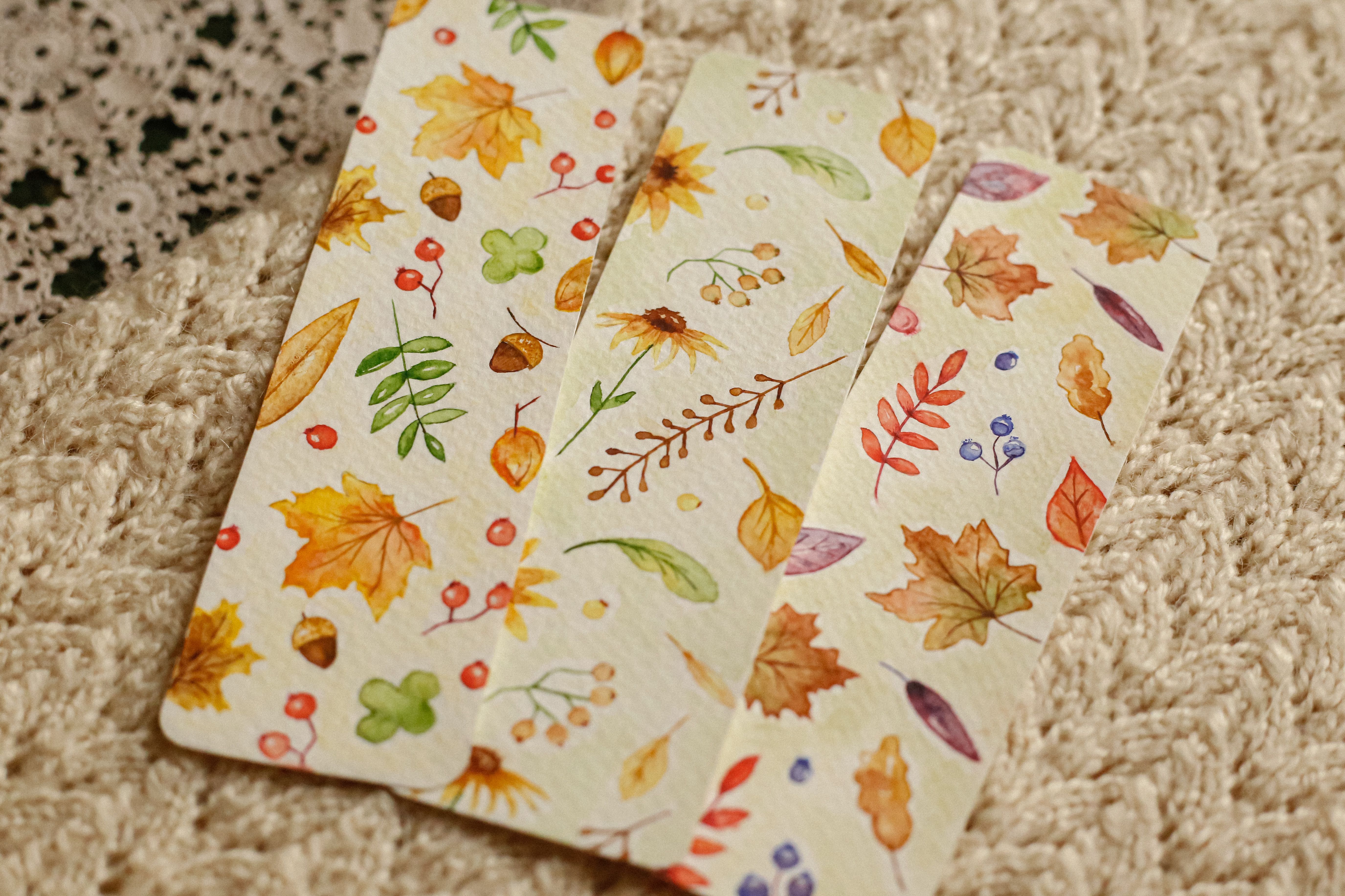 A collage of different spork art projects: a fall leaf wreath, a fall tree scene, a leaf garland, and personalized cards.
