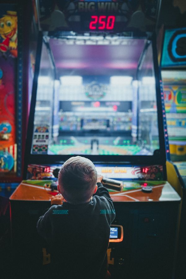 Children's entertainment business for sale - child playing an arcade game