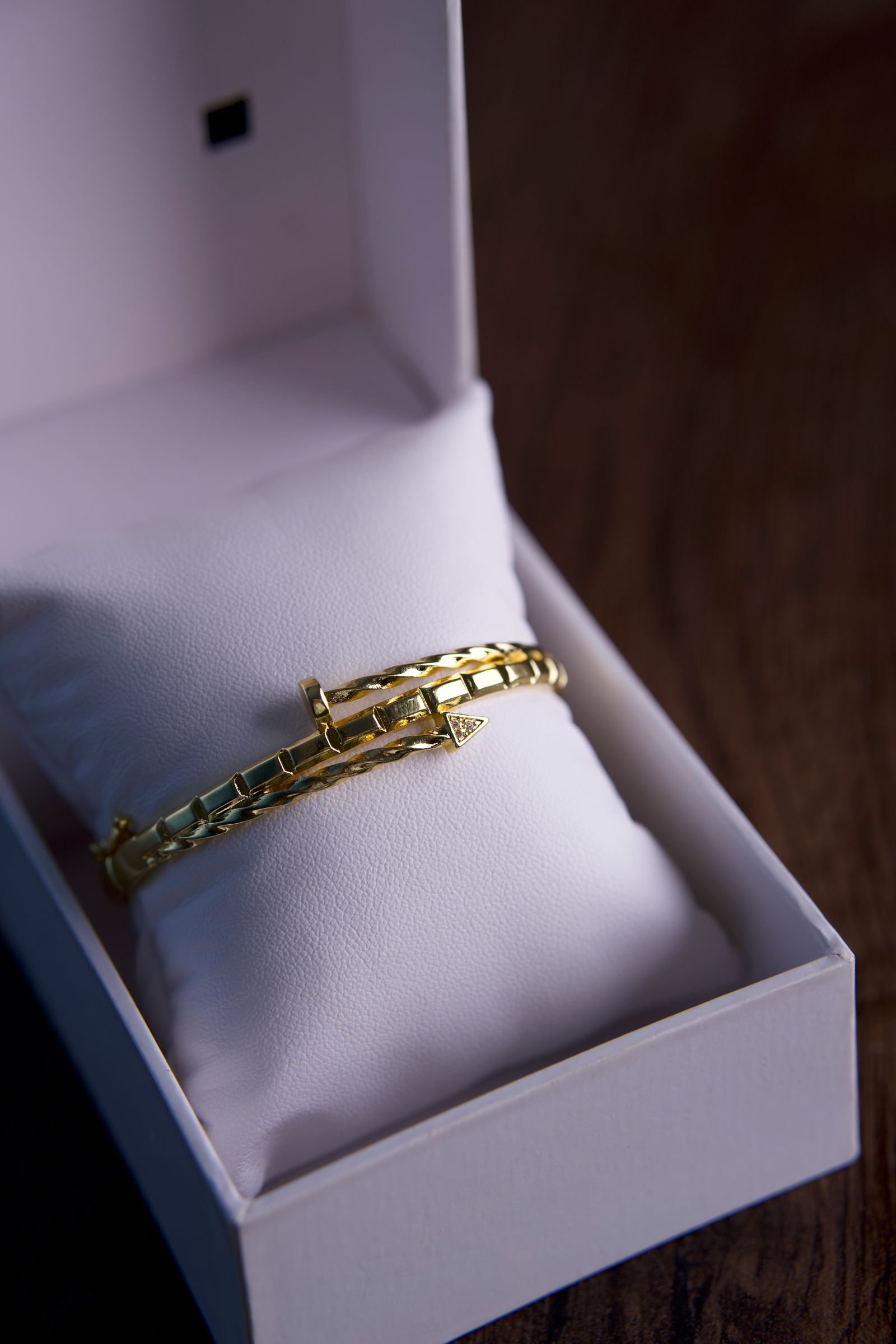 Luxurious gold bracelet in an open gift box