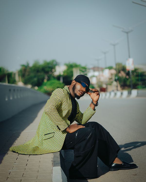 Stylish Man Posing on Urban Street in Bright Jacket · Free Stock Photo