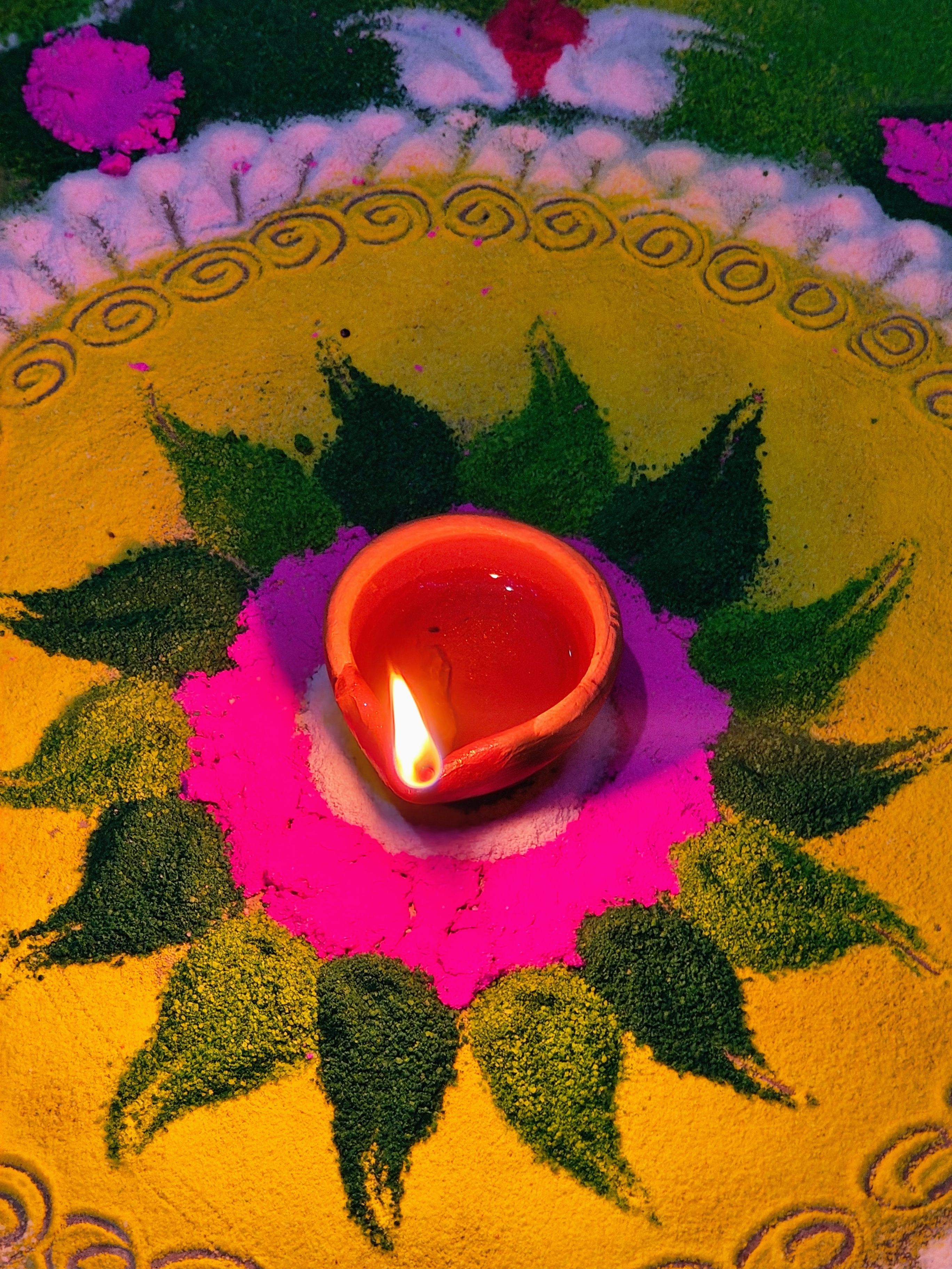 Diwali Rangoli with Lit Clay Lamp · Free Stock Photo