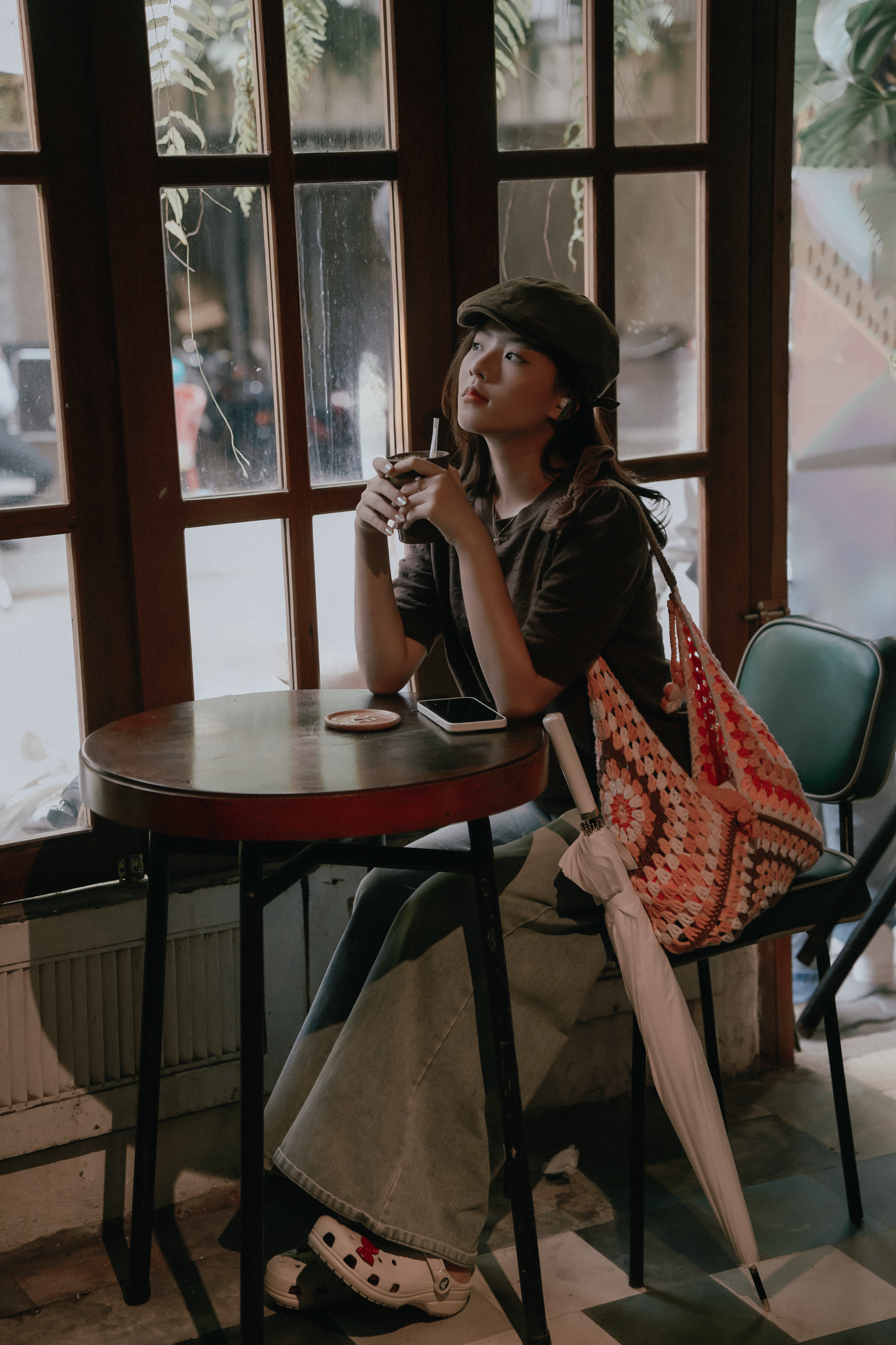 Young Woman Relaxing in Cozy Coffee Shop · Free Stock Photo