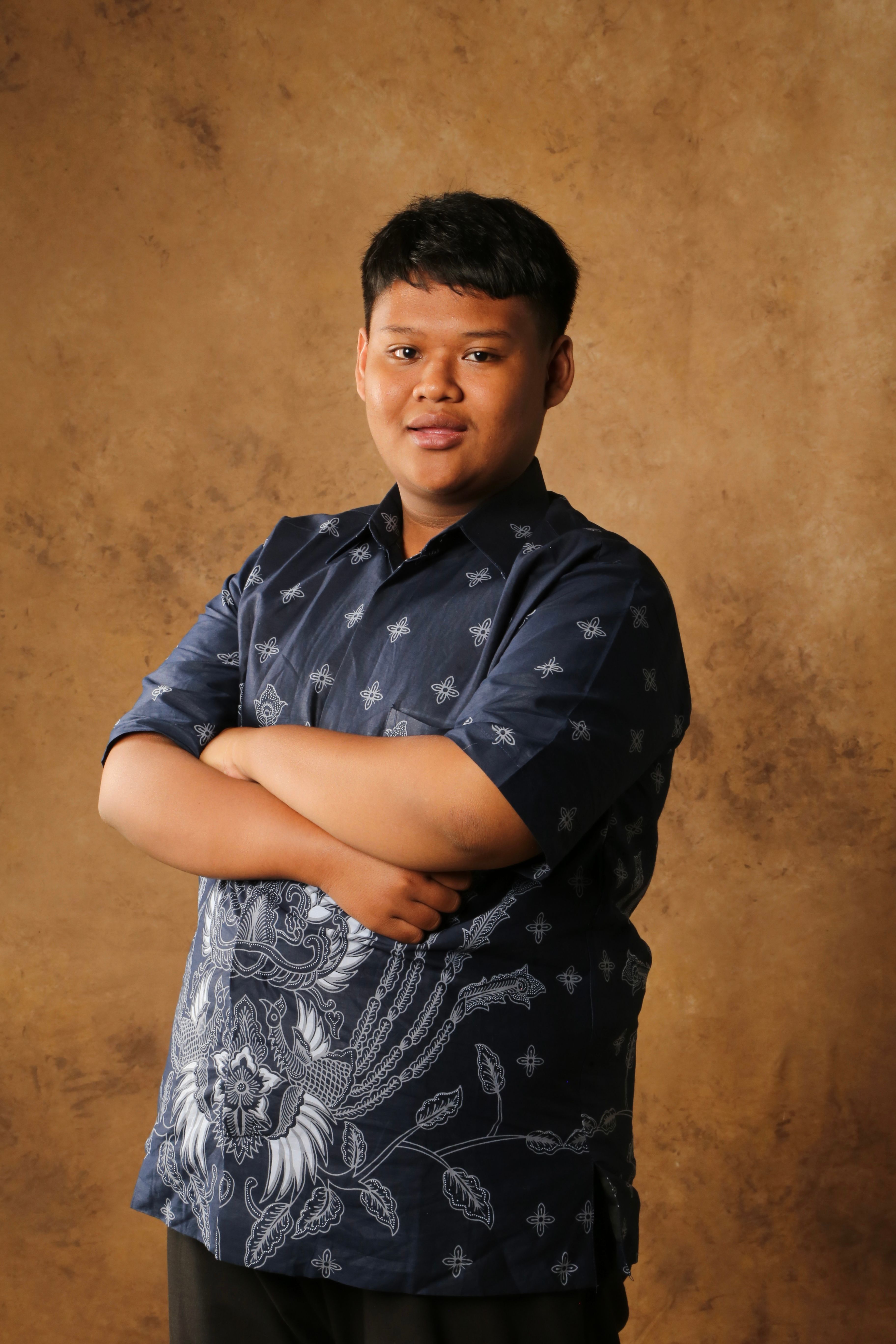 Portrait of a Confident Young Man in Traditional Batik Shirt