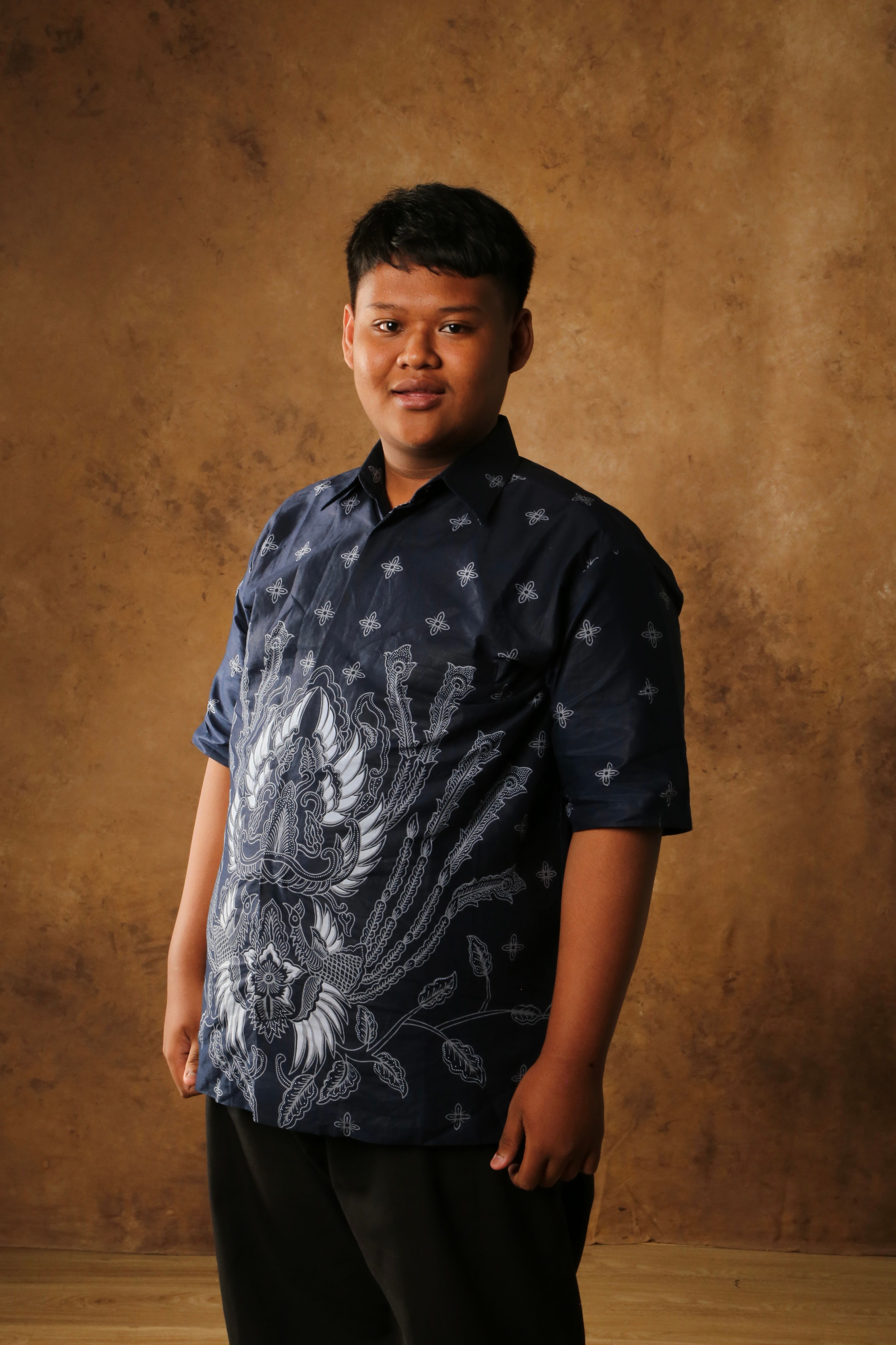 Portrait of a Young Man in Traditional Batik Shirt