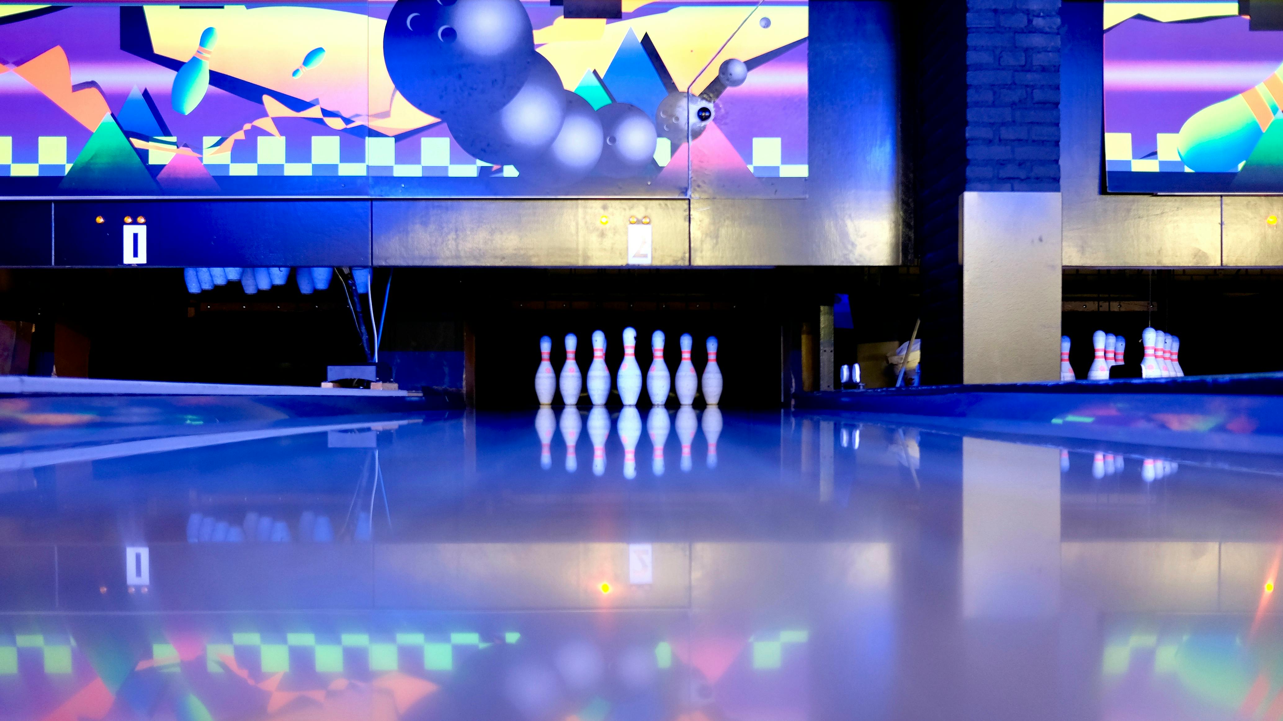 Bowling Pins Set on Ground · Free Stock Photo