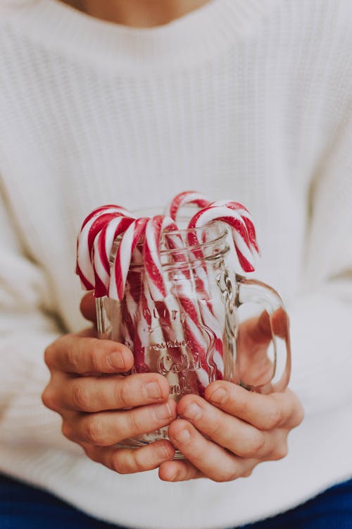 Free Photo Of Person Holding Jar With Candies Stock Photo