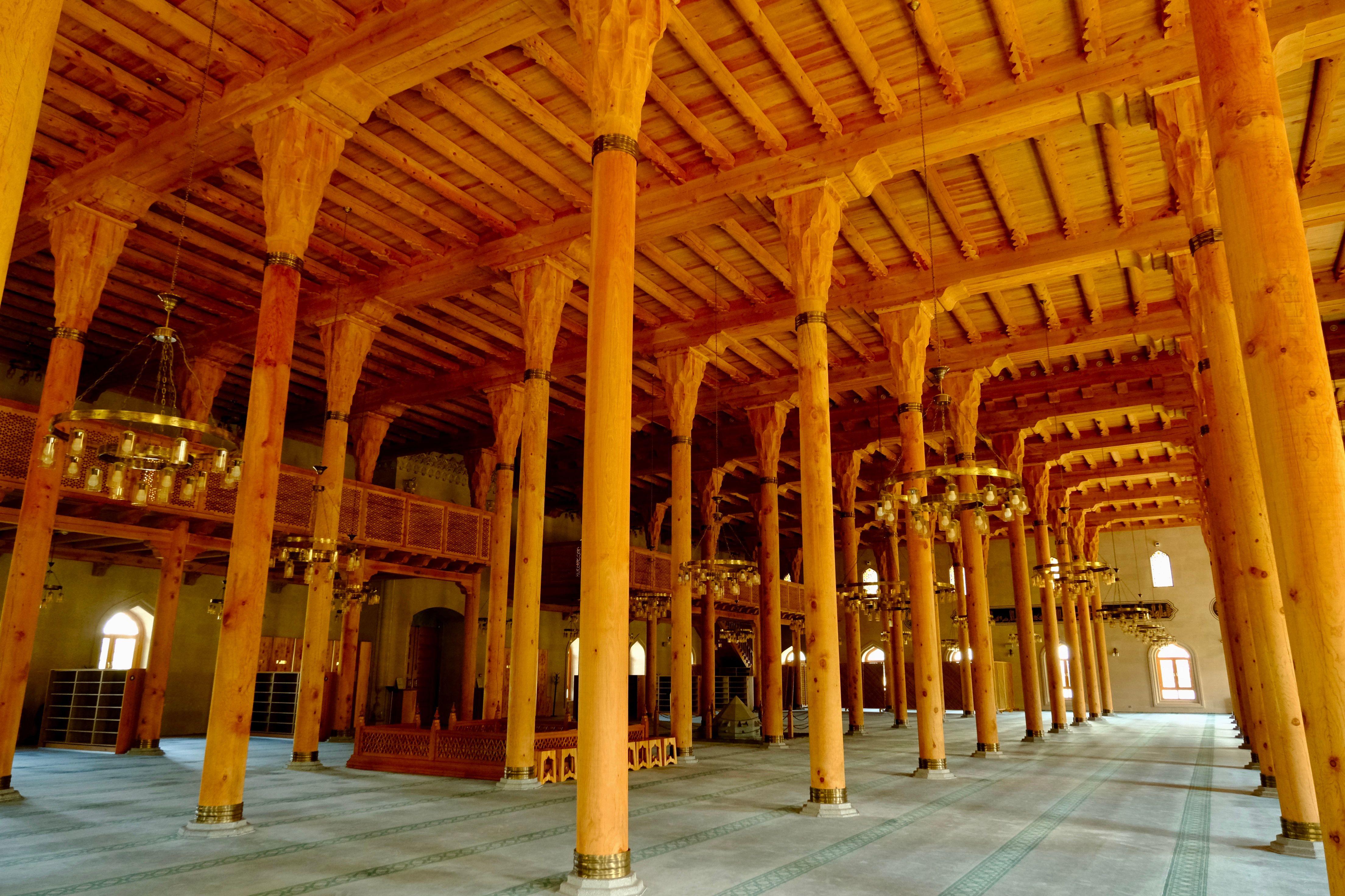 Majestic Wooden Mosque Interior with Columns · Free Stock Photo