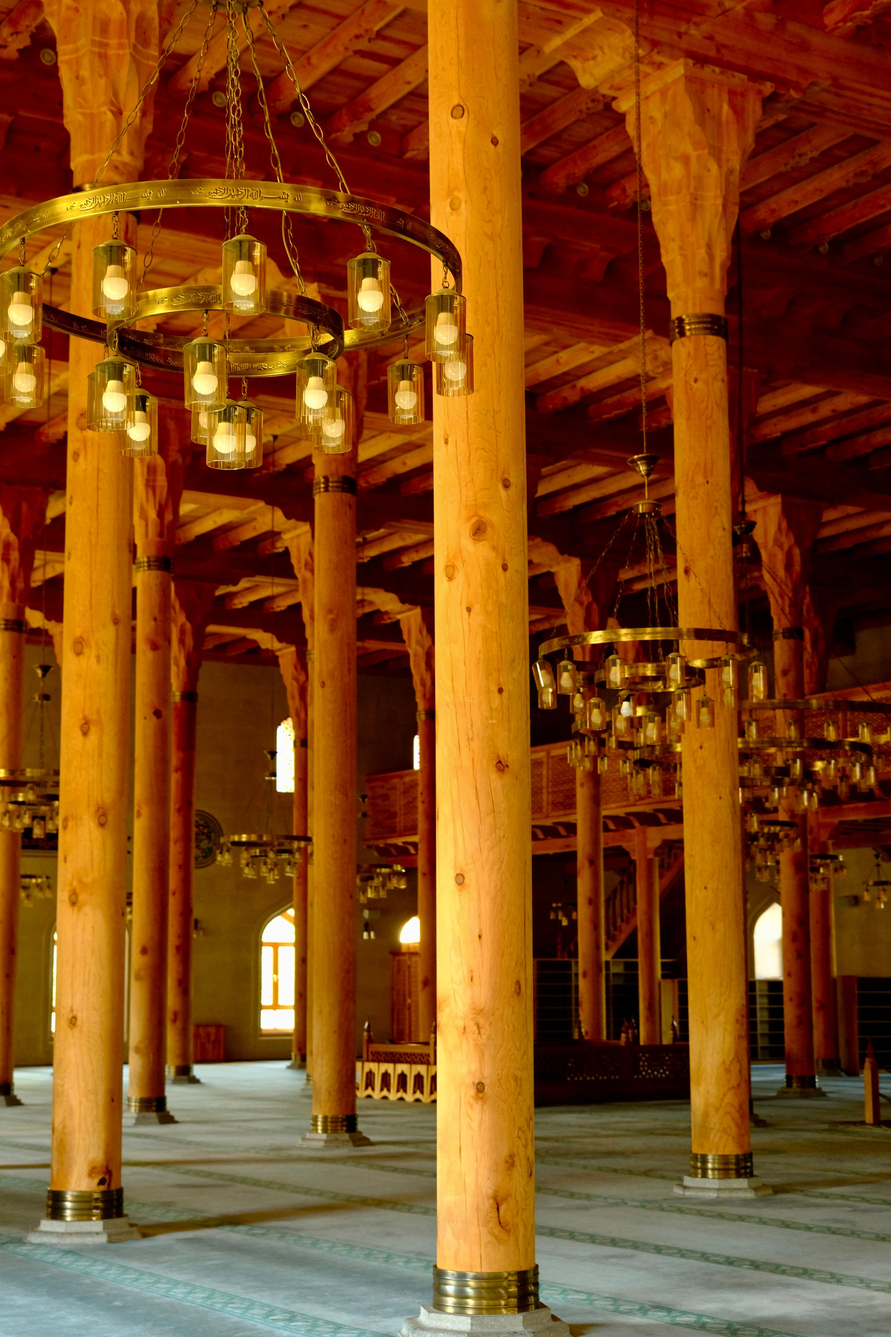 Interior of a Traditional Wooden Mosque with Chandeliers · Free Stock Photo