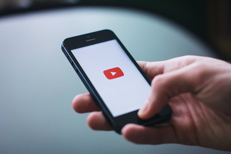 The Impact of YouTubers On Our Society Photo by freestocks.org from Pexels: https://www.pexels.com/photo/person-holding-space-gray-iphone-5-34407/