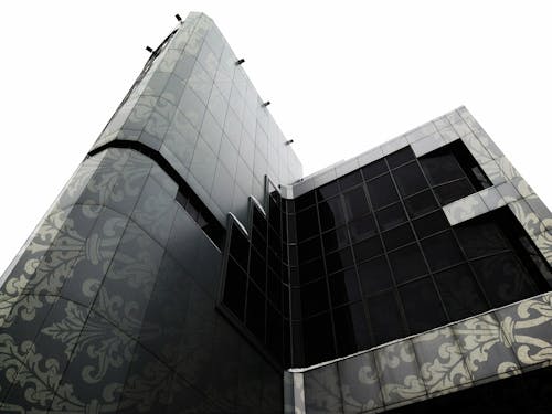 Grayscale Photography of Brown and Black Floral High-rise Building