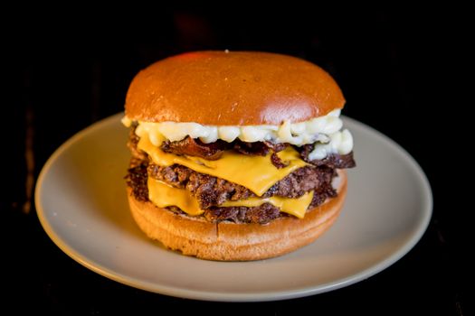 Mouth-watering double cheeseburger with juicy beef, melted cheese, and bacon.