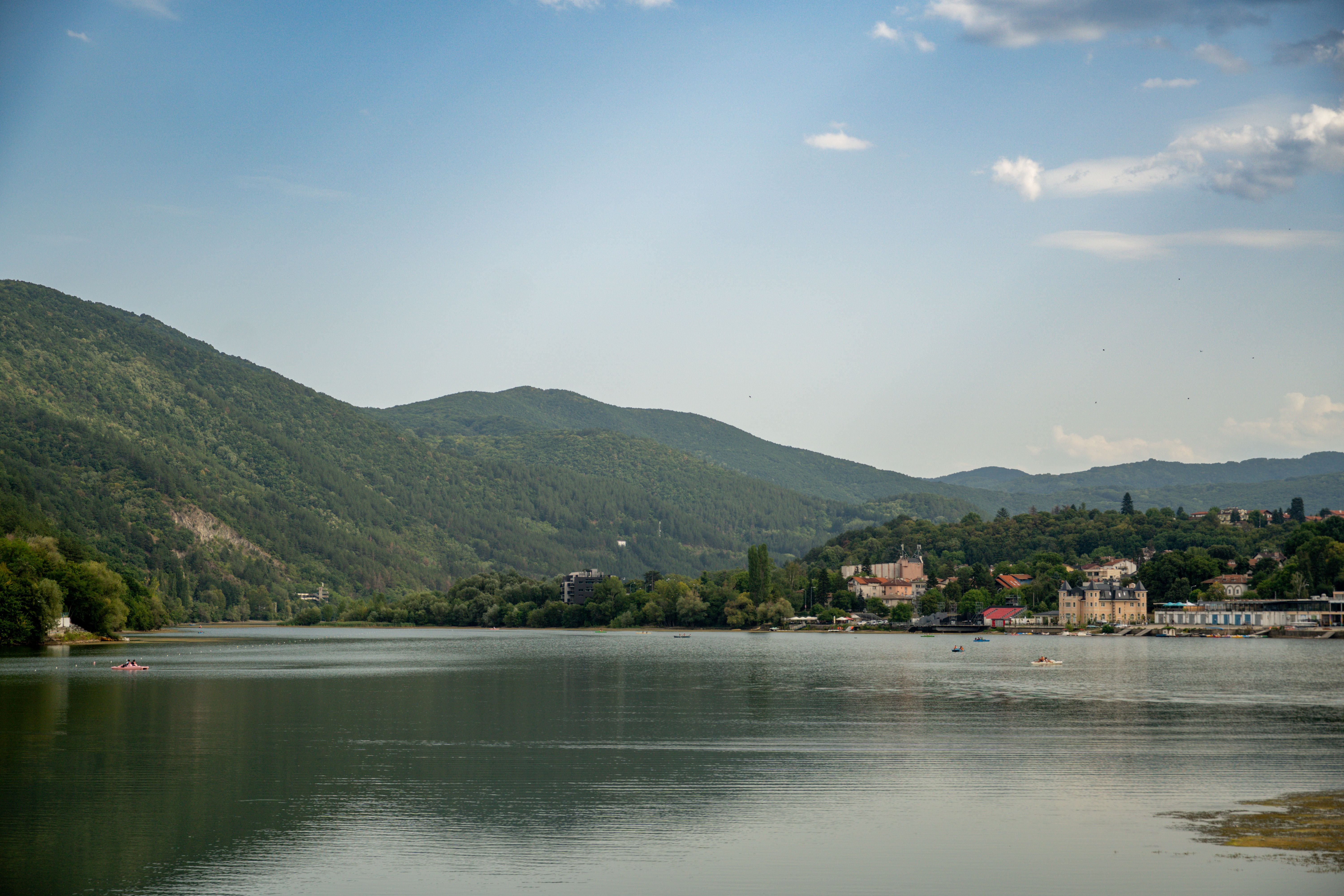 Pancharevo lake with the dam wall and the wooded hills of Lozenska Planina behind