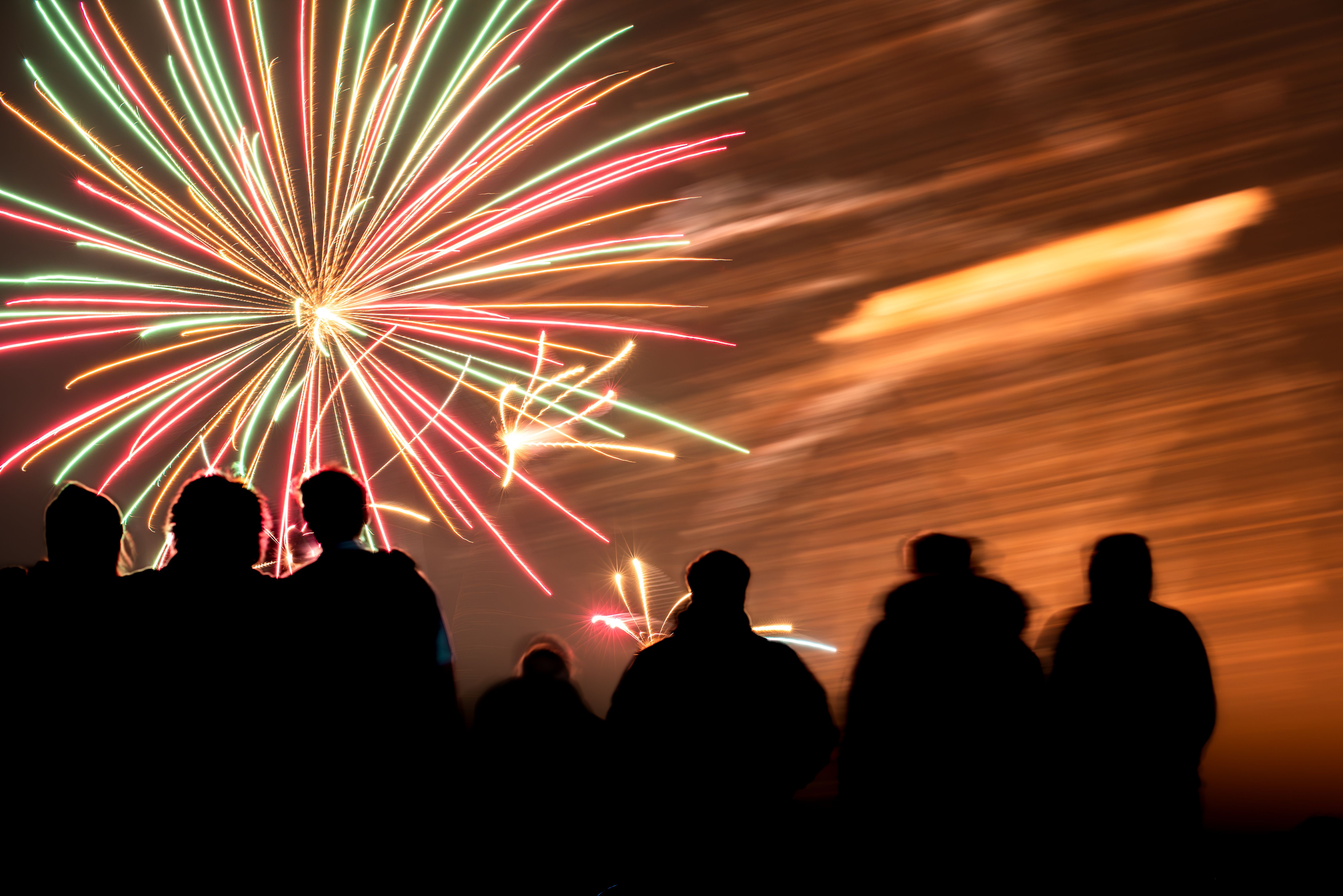 Colorful Fireworks Display with Crowd Silhouettes · Free Stock Photo