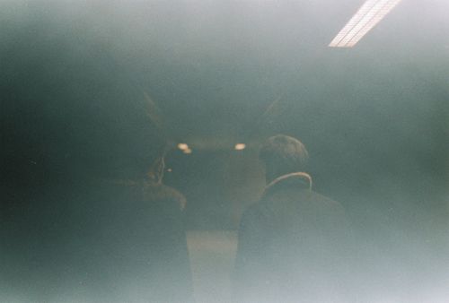 Free A mysterious analog film photo of two people in İstanbul's subway, evoking a vintage mood. Stock Photo