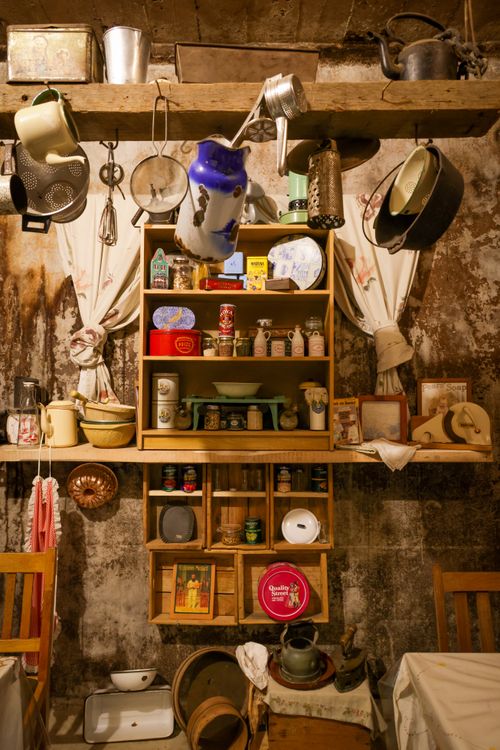 Free Warm, nostalgic vintage kitchen scene with rustic cookware and decor. Stock Photo