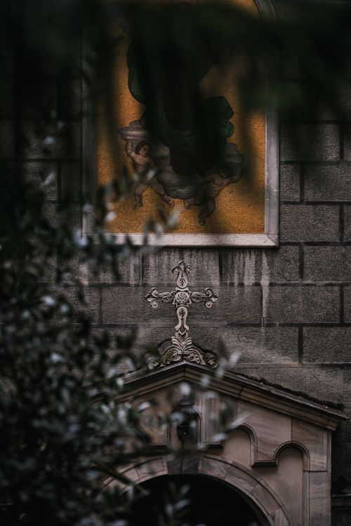 Free Intricate gothic church architecture with cross and religious artwork. Stock Photo