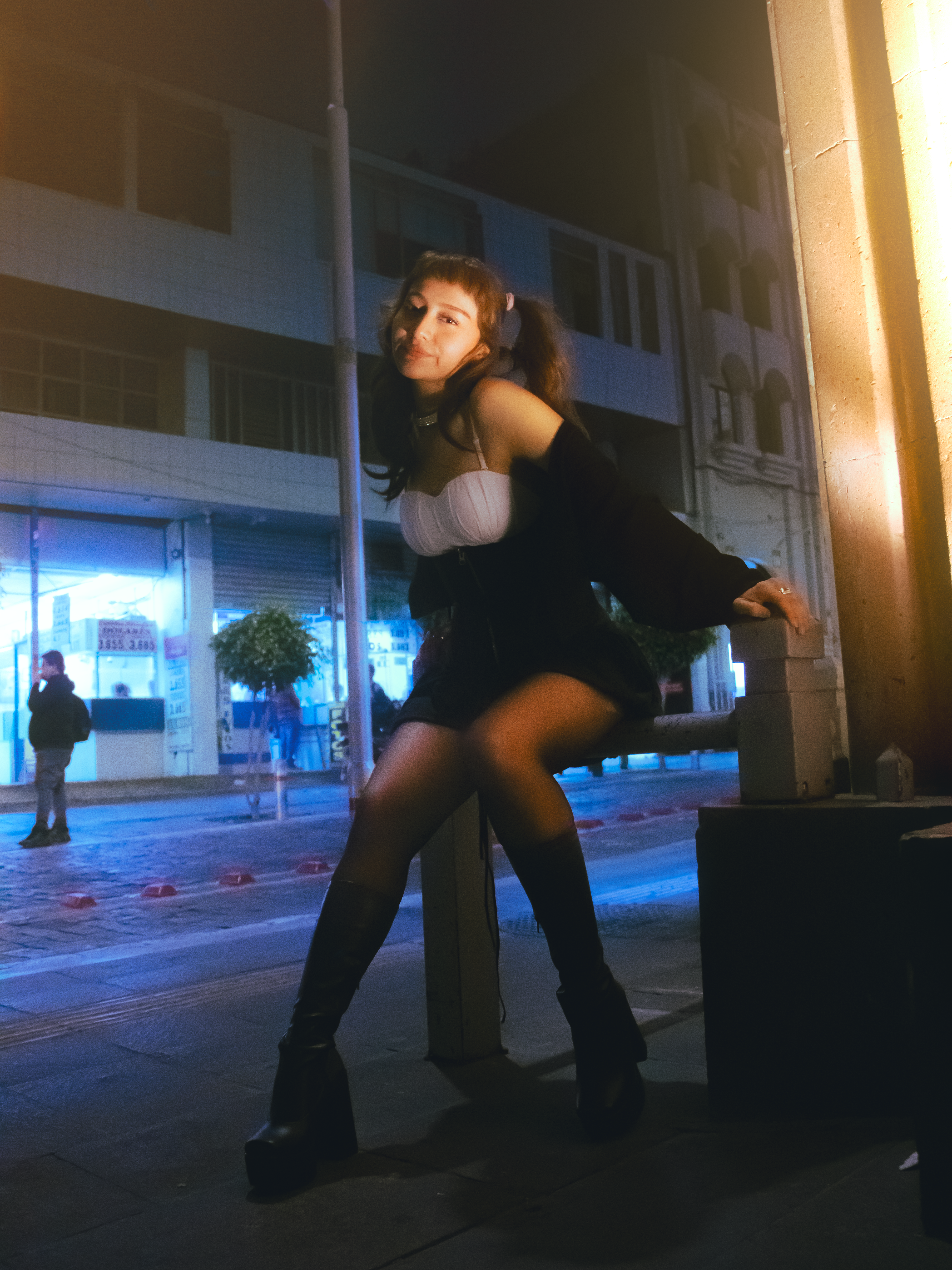 Stylish Young Woman Posing in Urban Night Scene · Free Stock Photo