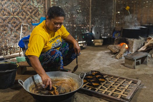 Indonesian artisan creates traditional palm sugar using organic methods in a rustic kitchen setting.