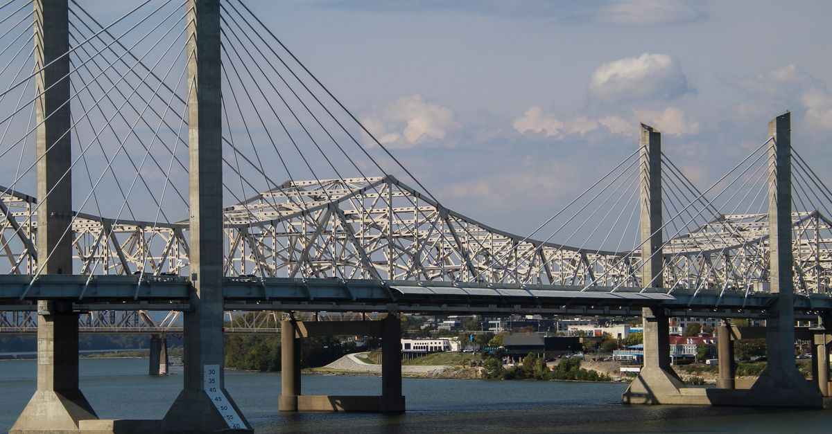 View of the cable-stayed bridge spanning the river, Louisville skyline in the background.