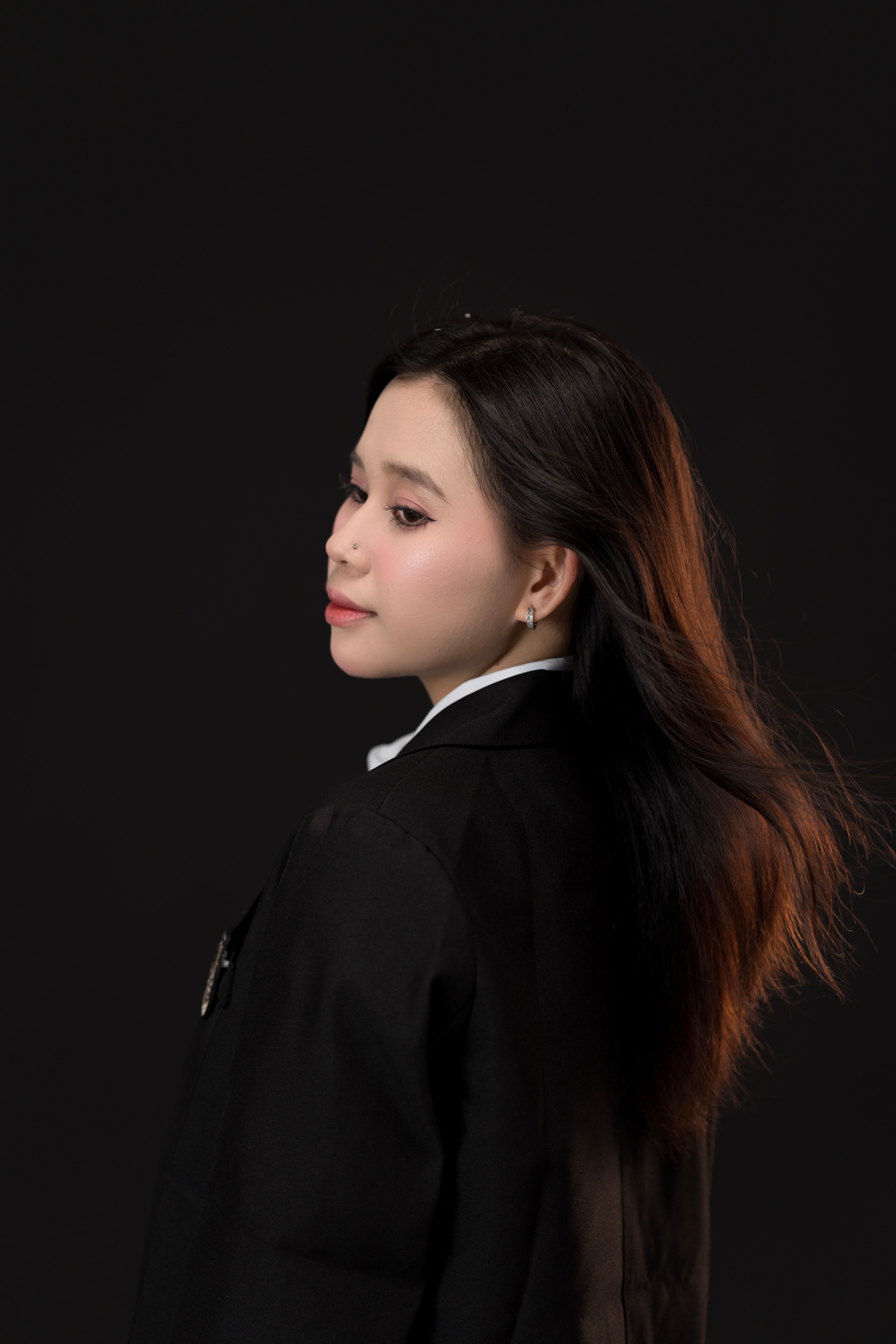 Elegant Portrait of a Young Woman in Black Suit · Free Stock Photo