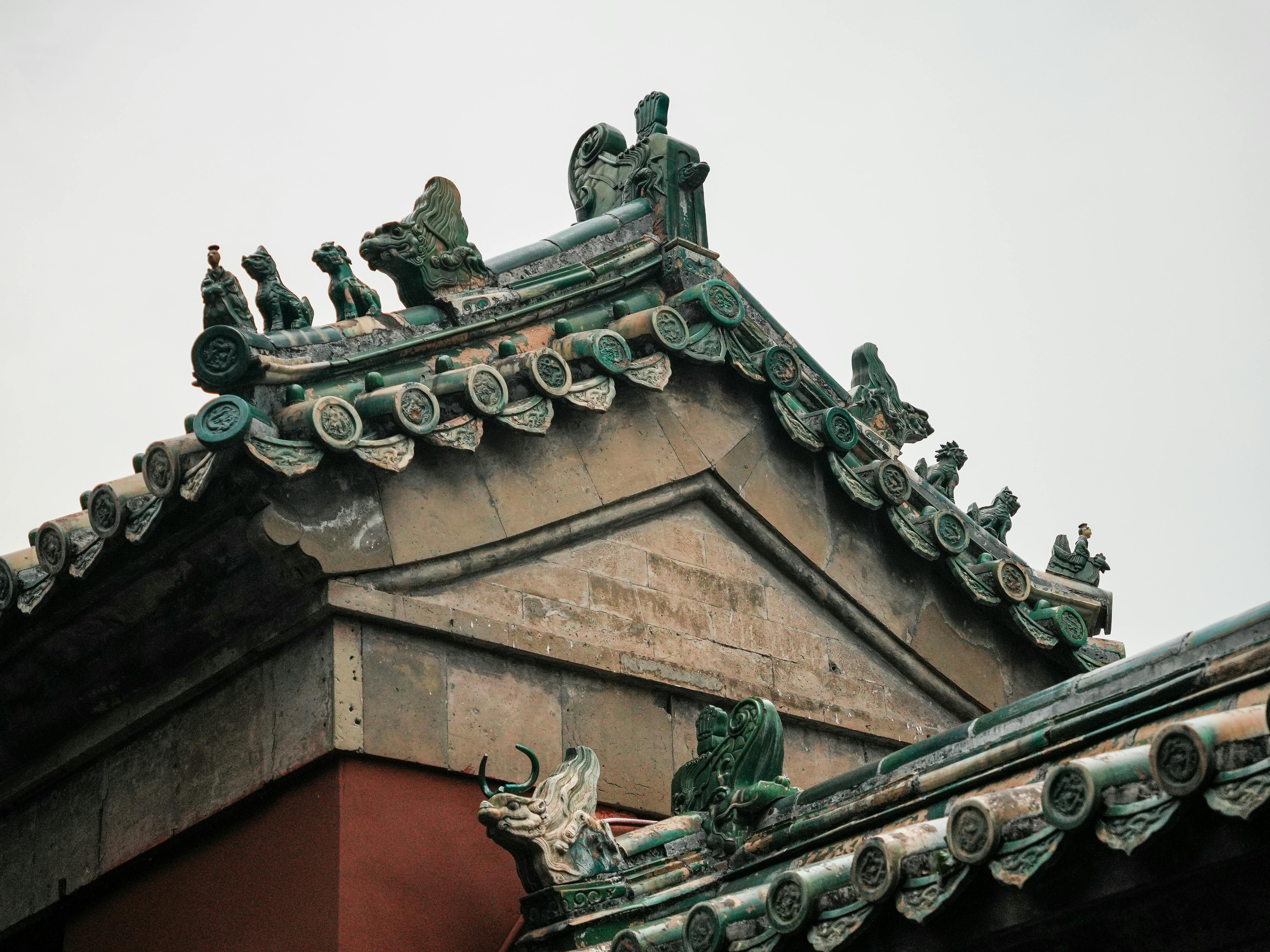 Close-up of ornate traditional Chinese roof with decorative figures.