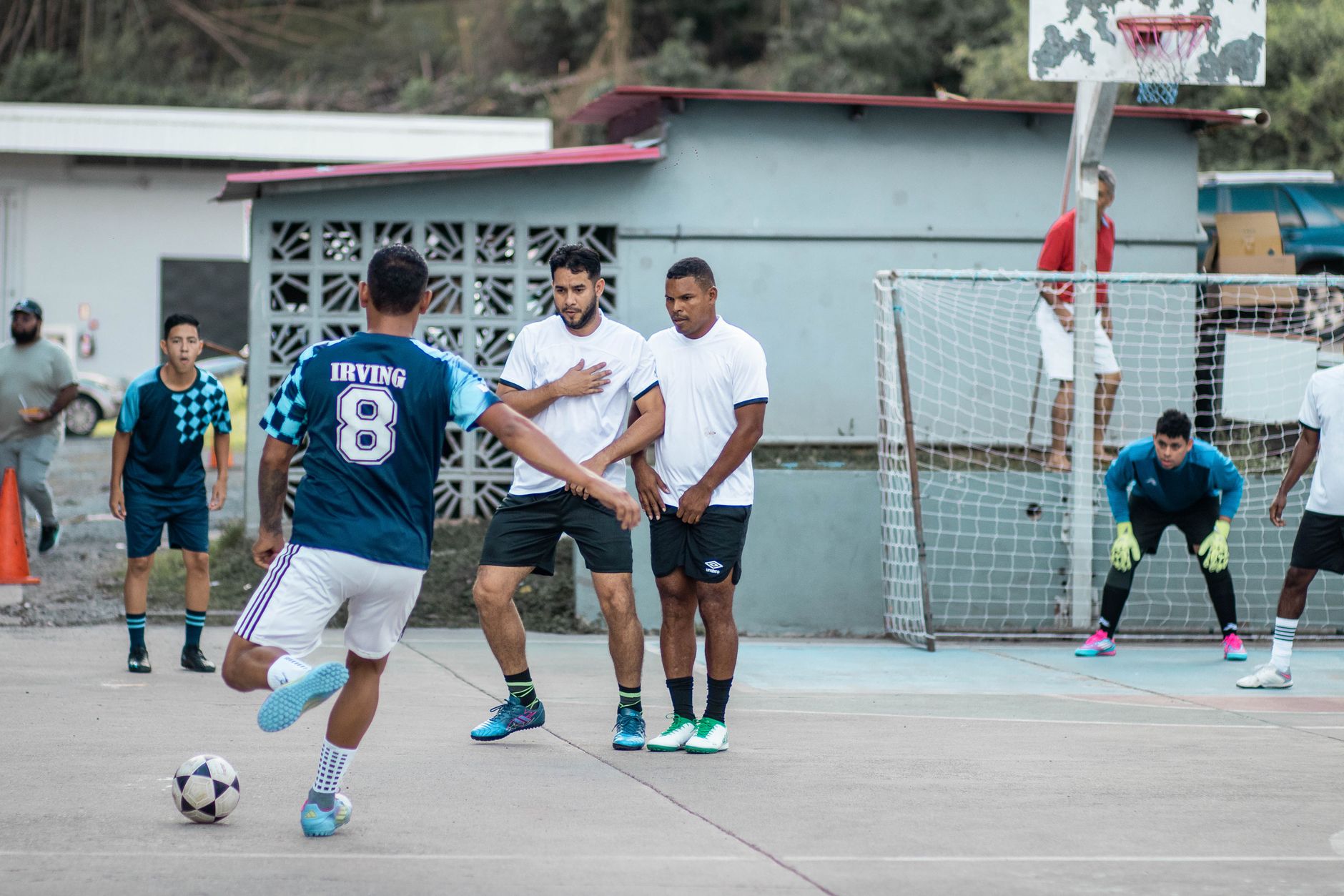 Dynamic capture of a soccer game with players in motion, showcasing teamwork and strategy.
