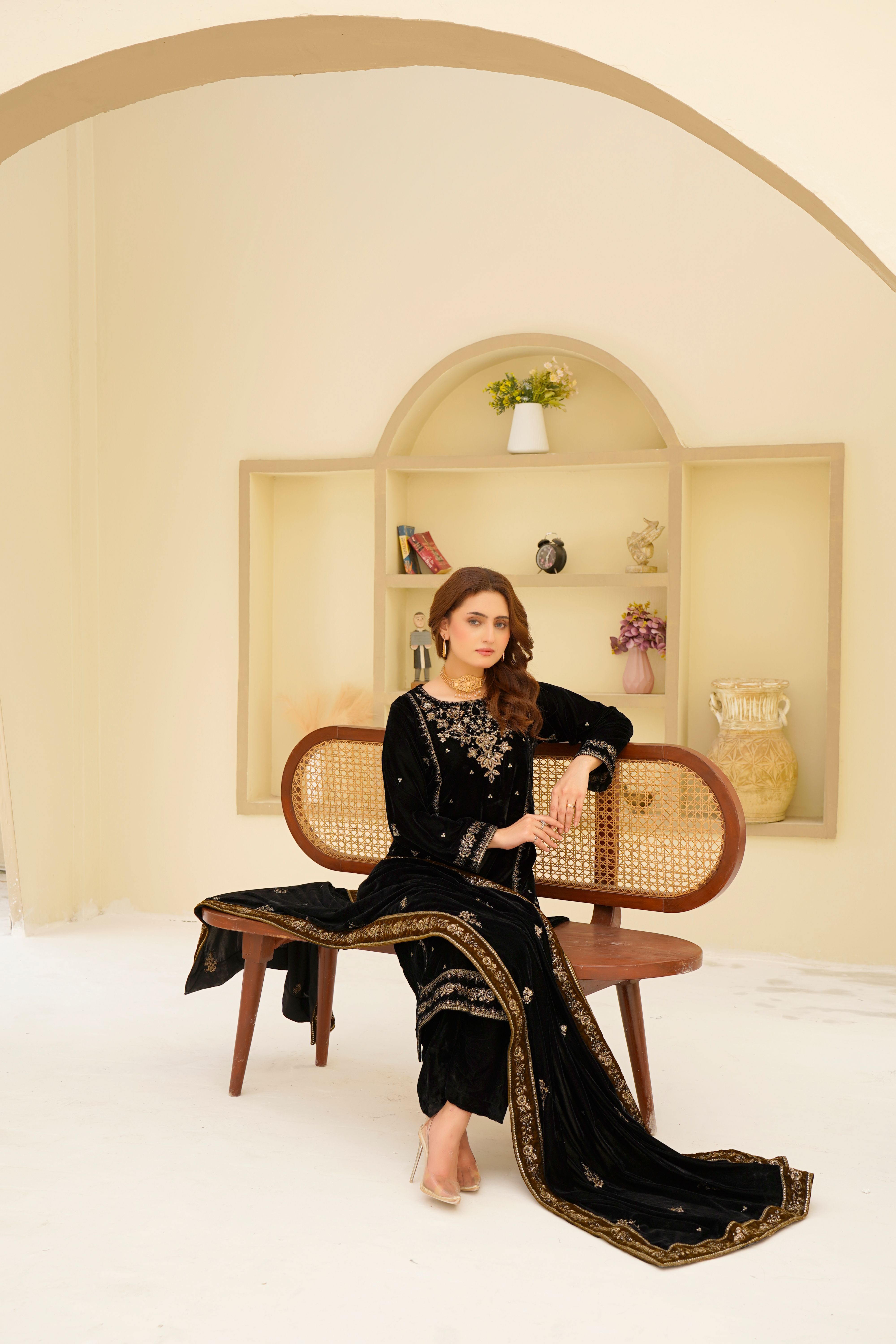 Elegant Woman in Black Traditional Dress Sitting Indoors · Free Stock Photo
