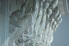 Close-up of carved architectural elements on a temple exterior showcasing traditional artistry.