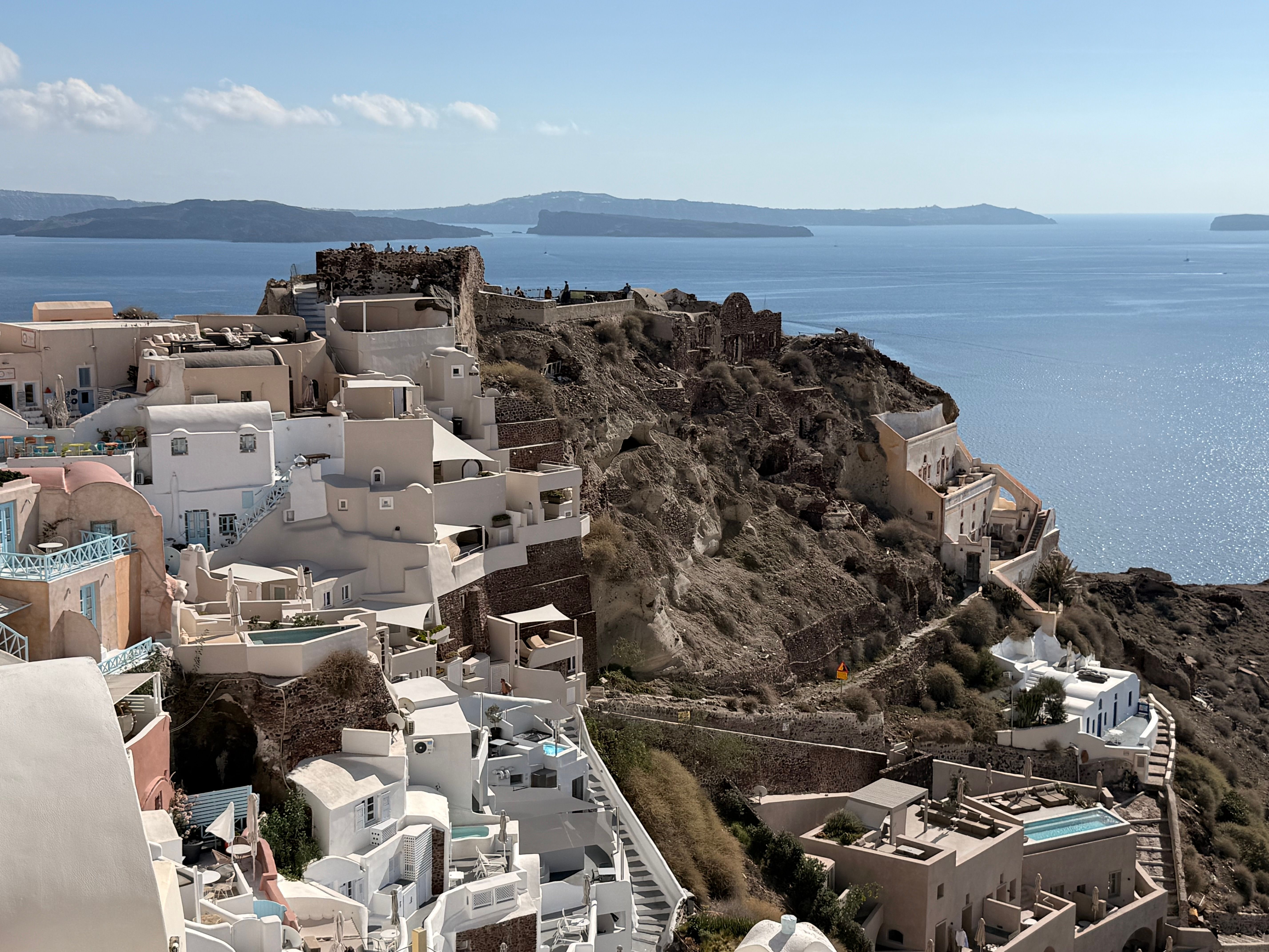 Scenic view of Oia, Santorini's iconic white buildings against the Aegean Sea, Greece