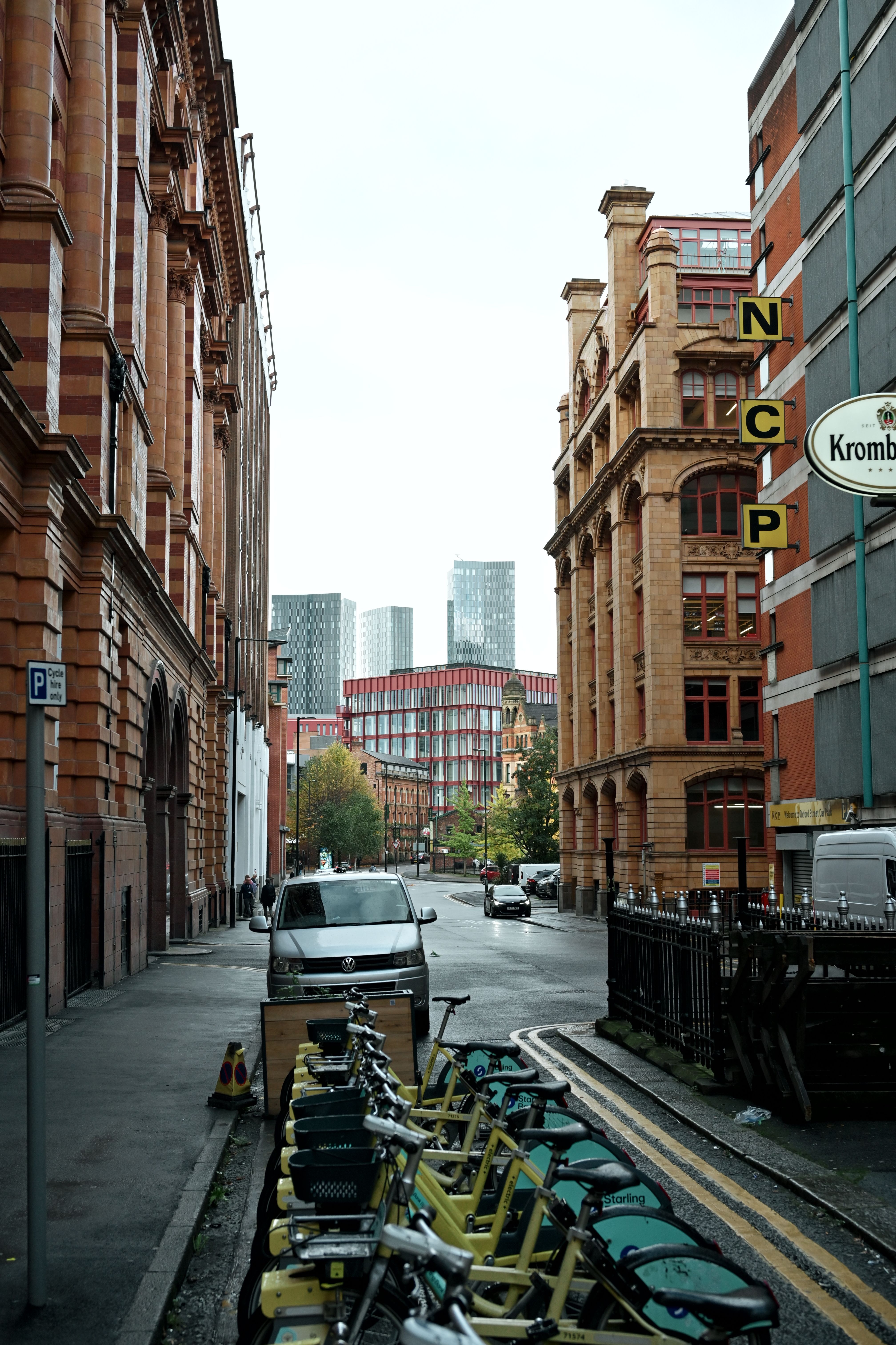 Urban Street View with Bicycles and Historic Buildings · Free Stock Photo