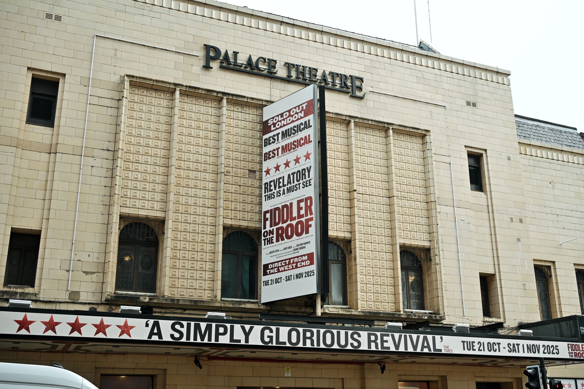 Palace Theatre facade showcasing the musical Fiddler on the Roof in a classic setting.