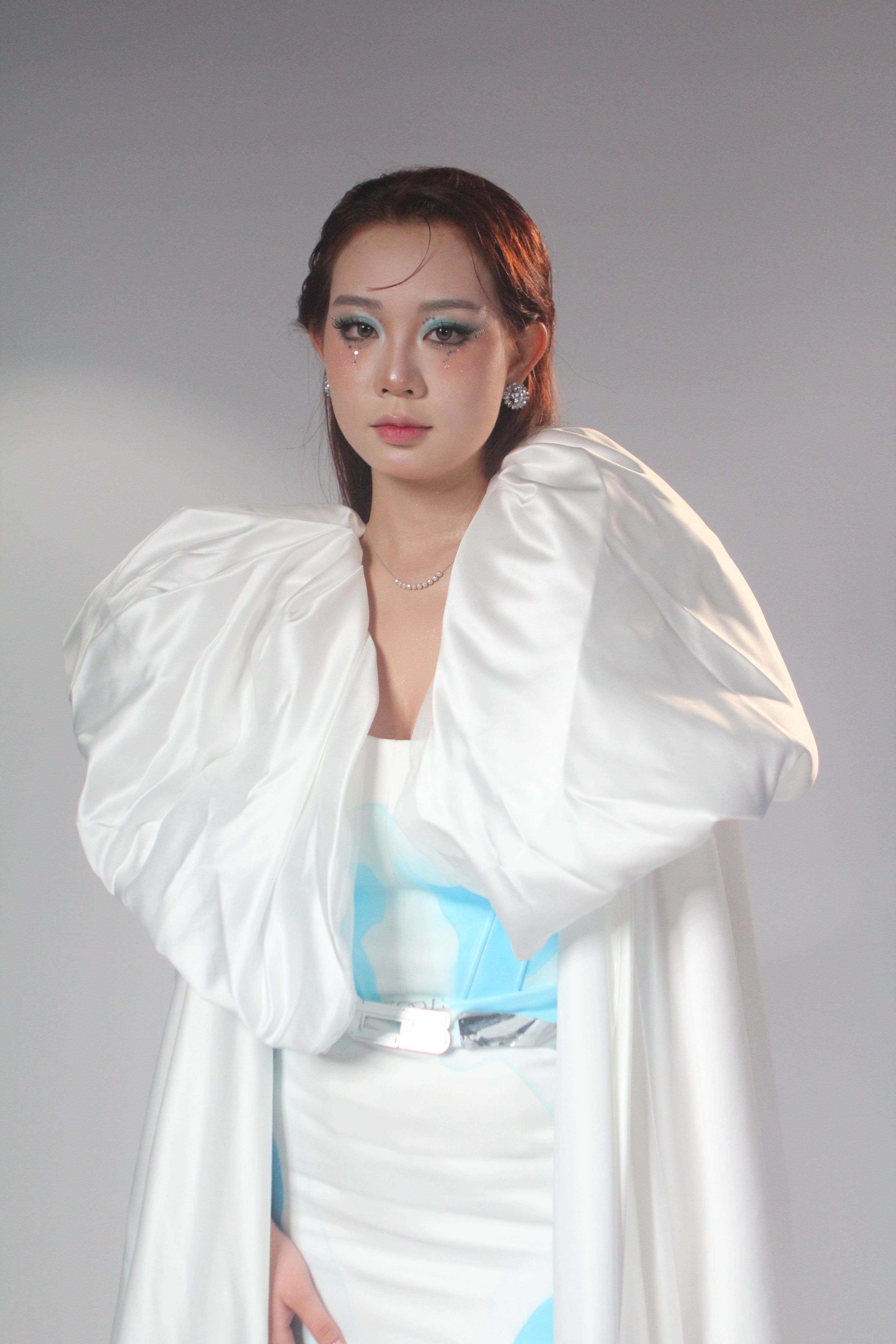 Elegant Woman in White Couture Gown · Free Stock Photo