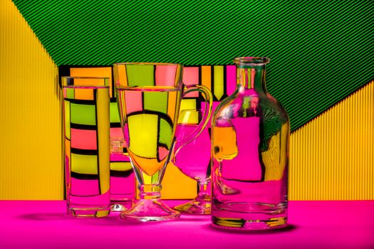 Glassware reflections on a vibrant, colorful abstract background, creating a striking visual effect.