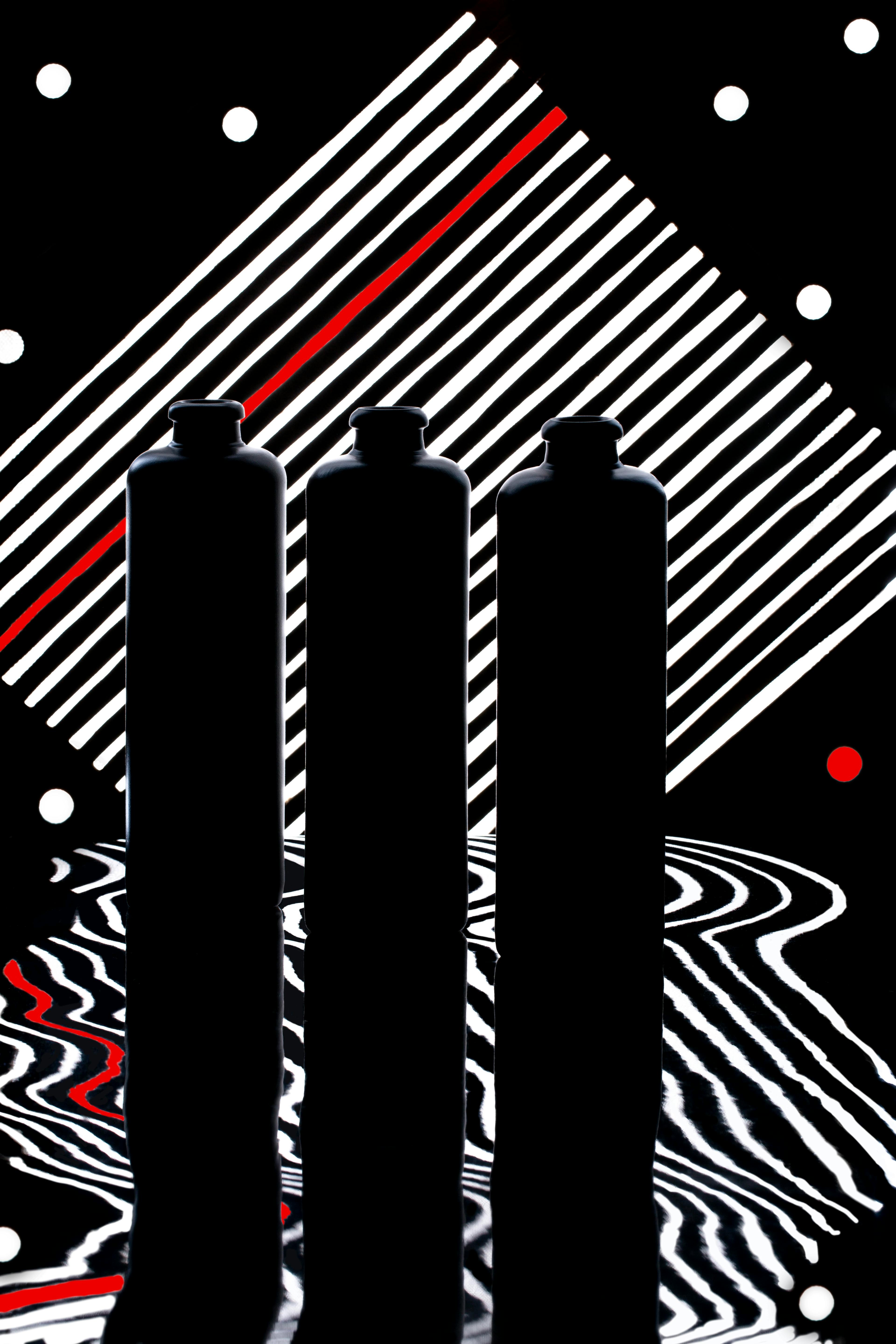 Gratuit Fotografie artistică a trei sticle siluete cu modele abstracte. Fotografie de stoc