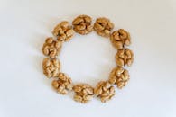 Circle of Walnuts on White Background