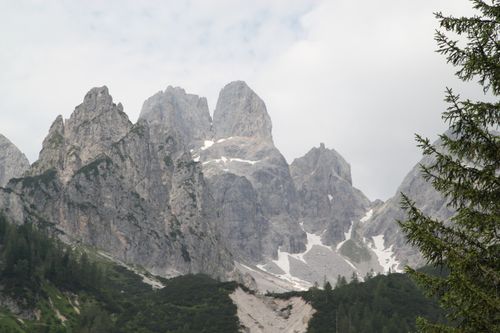 Free Breathtaking view of rugged alpine mountain peaks with patches of snow. Stock Photo