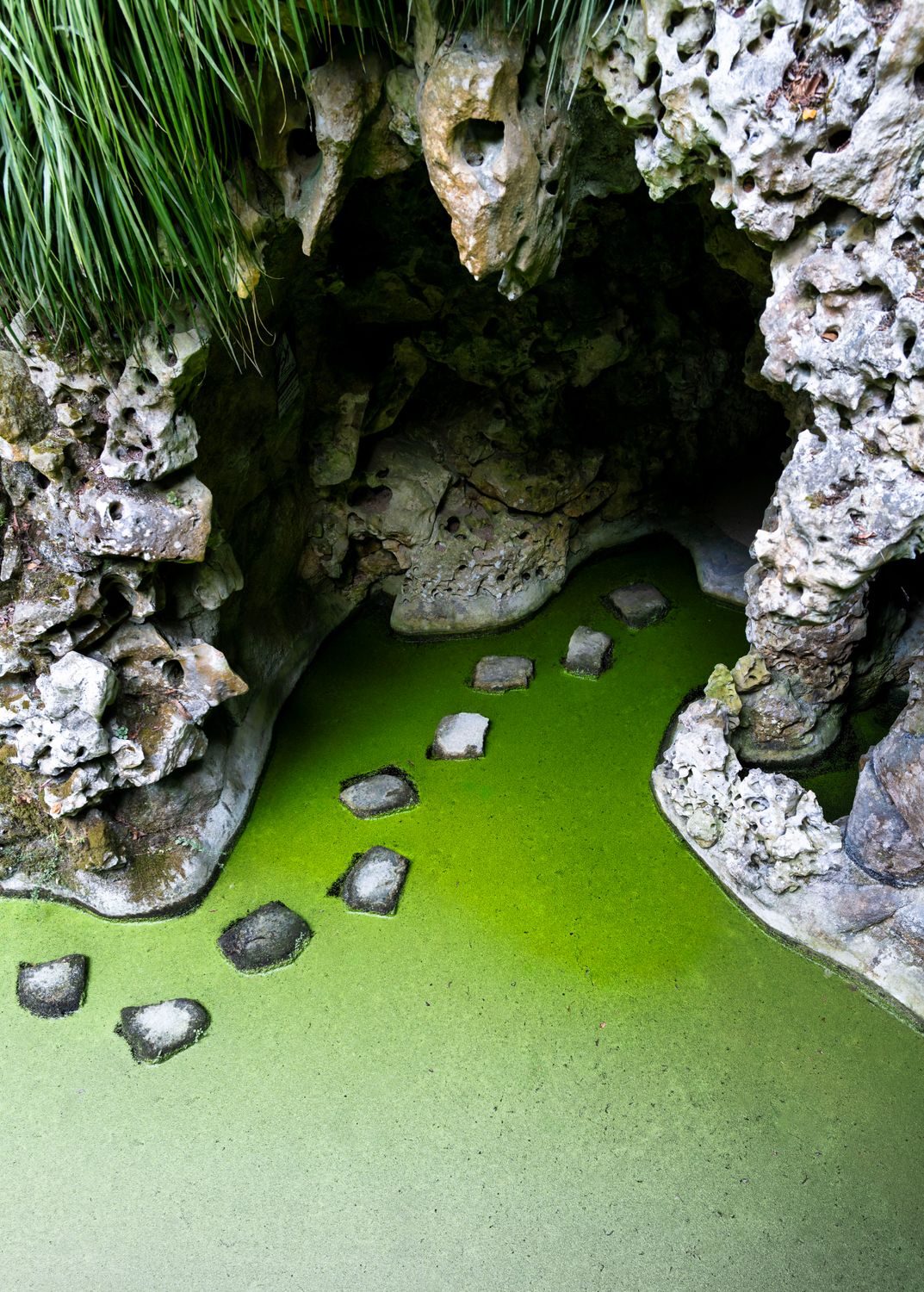Green Water Off Rocks Natural Rock Formation with Green Water · Free Stock Photo