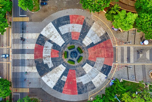 Stunning aerial view of a colorful circular park in Jakarta, showcasing unique patterns and vibrant greenery.