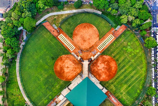A stunning aerial perspective of a baseball field surrounded by greenery in Jakarta, Indonesia.
