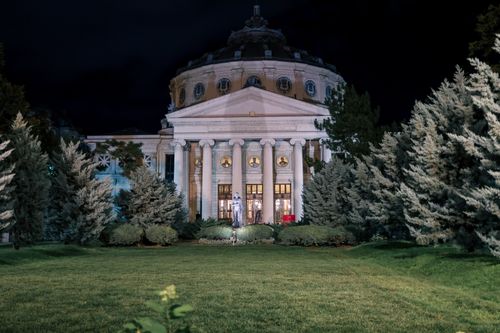 Free The Romanian Athenaeum illuminated at night, showcasing grand architecture in Bucharest, Romania. Stock Photo