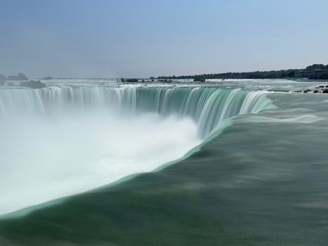 Breathtaking view of Niagara Falls showcasing powerful waterfall and serene landscape.