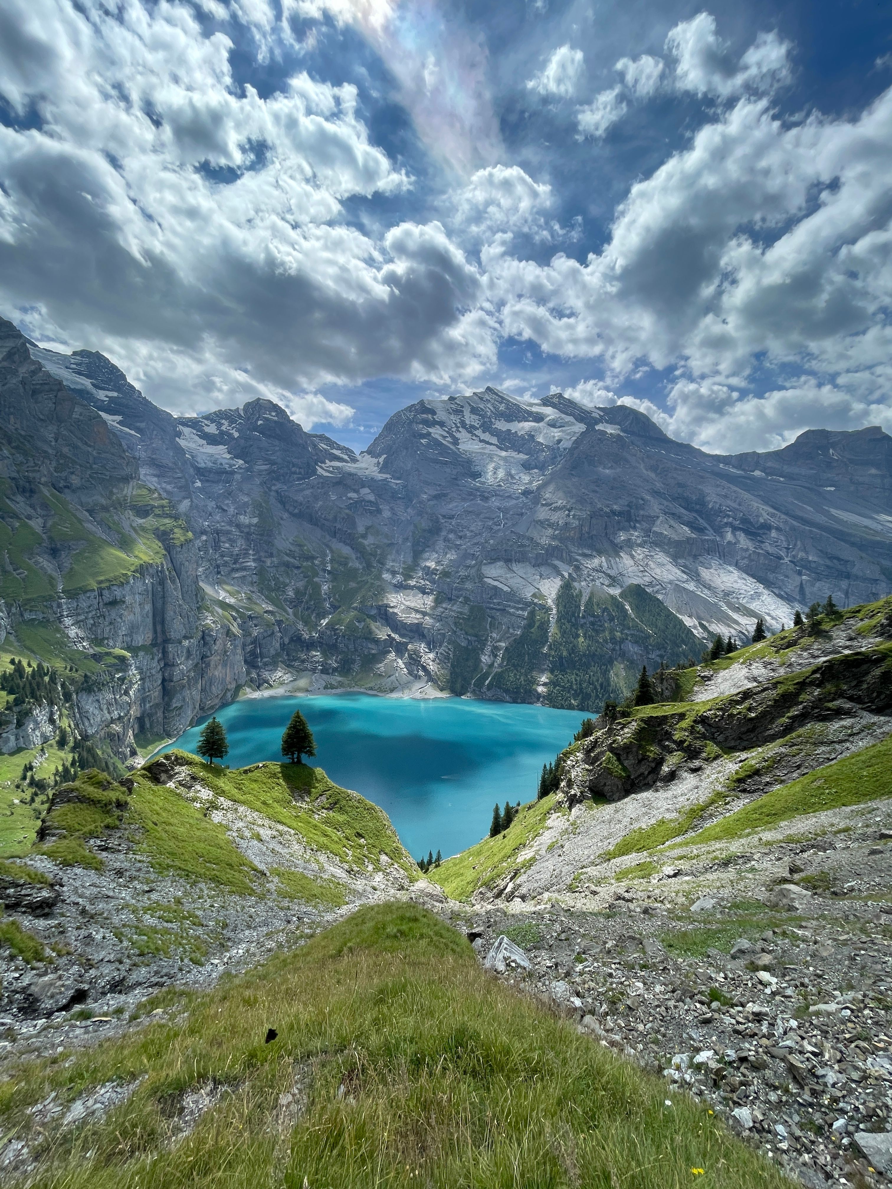 Mountain ridge and lake on cloudy day · Free Stock Photo