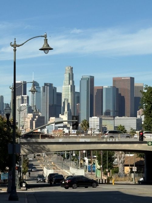 Free Scenic view of downtown Los Angeles skyline under a clear blue sky. Stock Photo