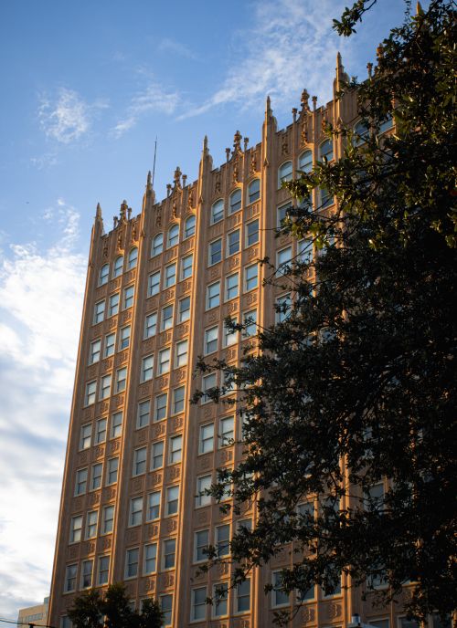Free An Art Deco building in Midland, Texas, framed by clear skies and trees. Stock Photo