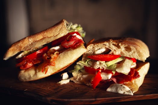 Close-up of a mouthwatering bacon and vegetable sandwich on rustic board. Perfect for food lovers.