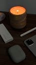 Warm Candlelit Desk Scene with Gadgets